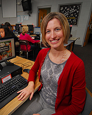 Kristen Ziller, library media specialist at Durant Road Year-Round Middle School in Raleigh, in the media center where she works with eighth graders on research using Ancestry.com resources. Ziller was part of a team of educators organized by UNC-Chapel Hill School of Education's LEARN NC who developed a curriculum guide that demonstrates how to use Ancestry.com resources in social studies classes.