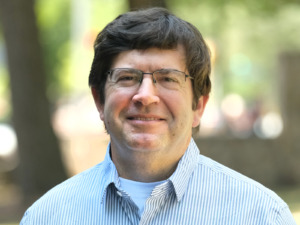 Portrait of faculty member Roger Mills-Koonce outdoors on the UNC-Chapel Hill campus.