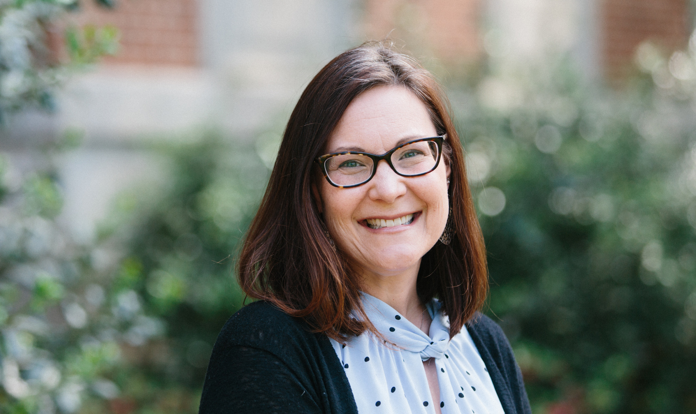 Photo of faculty member Jennifer Diliberto outside of Peabody Hall on the UNC-Chapel Hill campus