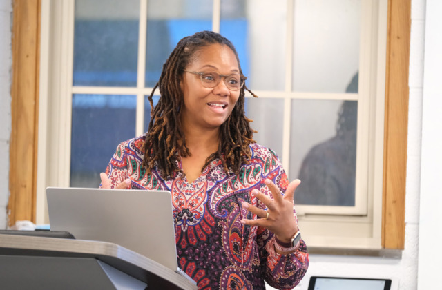 HOLD program director Jemilia Davis teaches in a Peabody Hall classroom with students engaging.