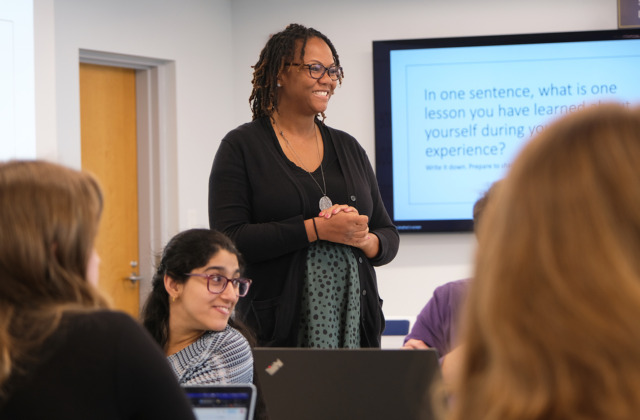 HOLD program director Jemilia Davis teaches in a Peabody Hall classroom with students engaging.