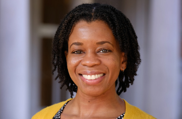 Woman with yellow top smiling
