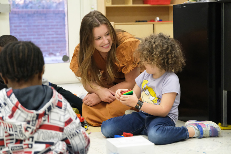 Grace Landrum with students at Carolina Community Academy