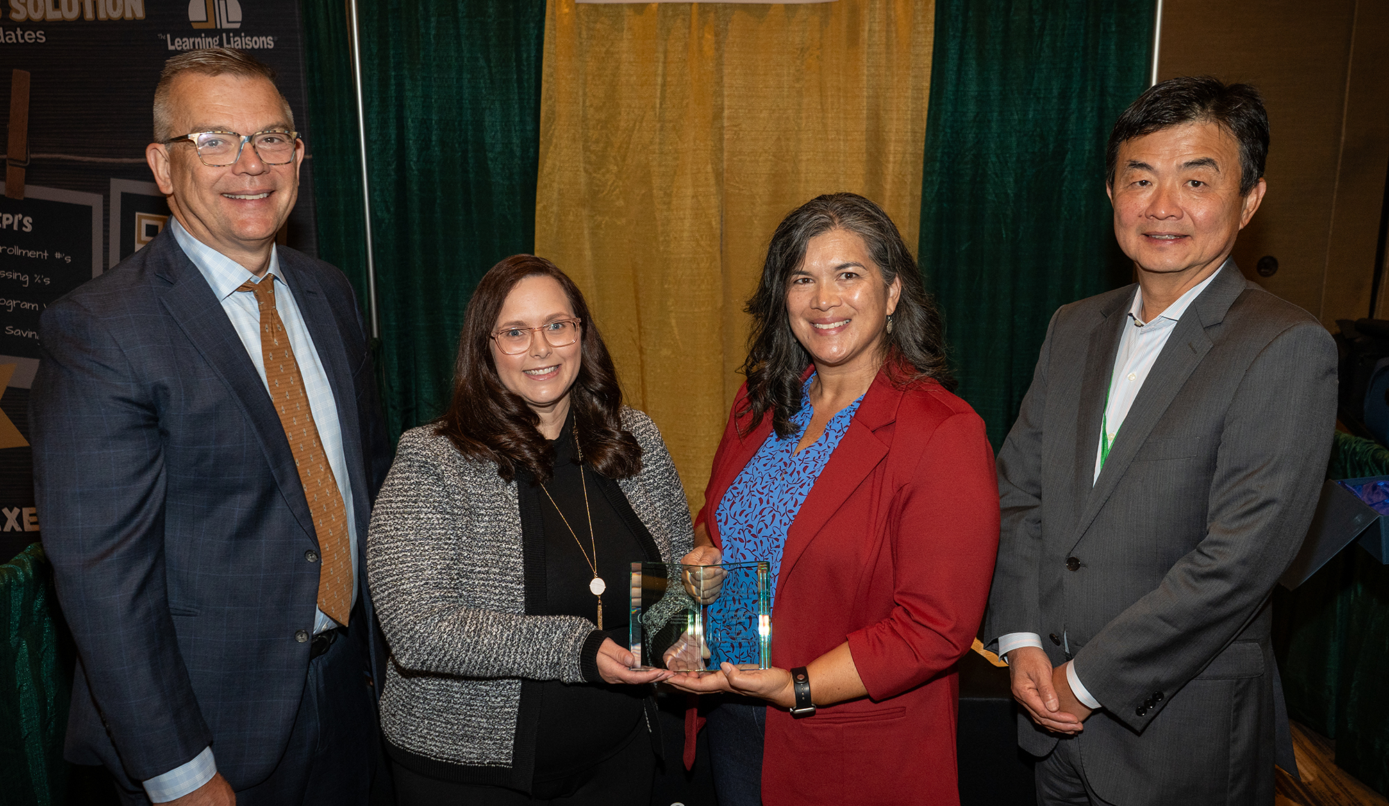 The UNC School of Education’s April Plumley, clinical partnerships and licensure manager, second from left, and Diana Lys, assistant dean for educator preparation and accreditation, second from right, accept the Frank Murray Leadership Recognition for Continuous Improvement, on Sept. 9, at the fall 2024 CAEPCon in Arlington, Va. They are pictured with Christopher A. Koch, CAEP president, and Yuhang Rong, chair of the CAEP Board of Directors