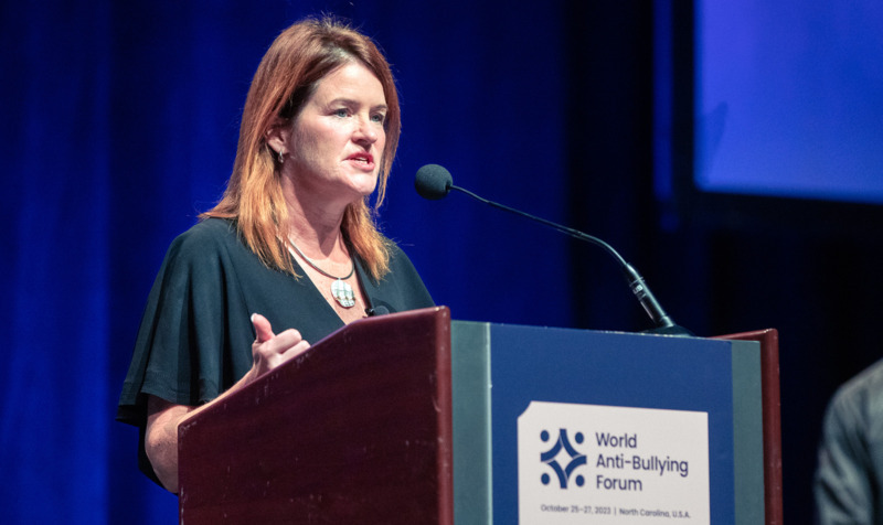 Dorothy Espelage speaking at a podium during the 2025 World Anti-Bullying Forum.