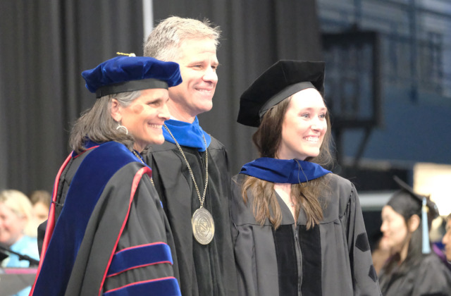 Troy Sadler, center, poses with Dean Jill V. Hamm, left, and Ph.D. graduate Rebecca Lesnefsky at the UNC School of Education graduation ceremony on Saturday, May 10, 2025, in Carmichael Arena.