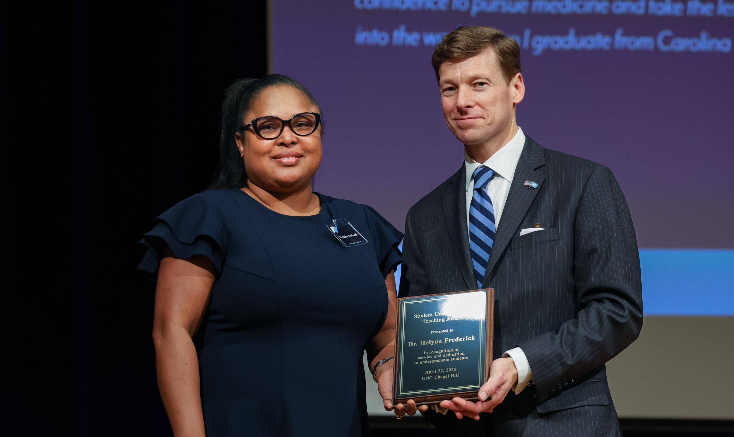 Helyne Frederick (left) accepts the 2025 Student Undergraduate Teaching Award from Chancellor Lee H. Roberts (right) at the April 22 awards ceremony. Photos courtesy of Student Life & Leadership — Carolina Union (HuthPhoto)