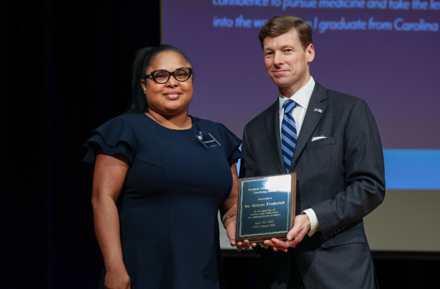 Helyne Frederick (left) accepts the 2025 Student Undergraduate Teaching Award from Chancellor Lee H. Roberts (right) at the April 22 awards ceremony. Photos courtesy of Student Life & Leadership — Carolina Union (HuthPhoto)