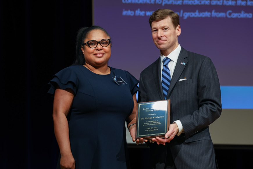 Helyne Frederick (left) accepts the 2025 Student Undergraduate Teaching Award from Chancellor Lee H. Roberts (right) at the April 22 awards ceremony. Photos courtesy of Student Life & Leadership — Carolina Union (HuthPhoto)