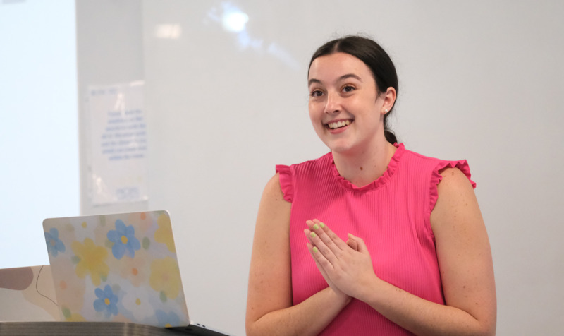 Human and Organizational Leadership Development student presents during the capstone symposium in Peabody Hall on the UNC-Chapel Hill campus.