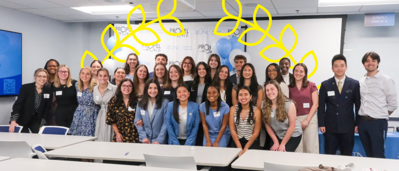 Human and Organizational Leadership Development - HOLD - students pose after delivering their final presentations during the annual capstone symposium in Peabody Hall on the UNC-Chapel Hill campus.