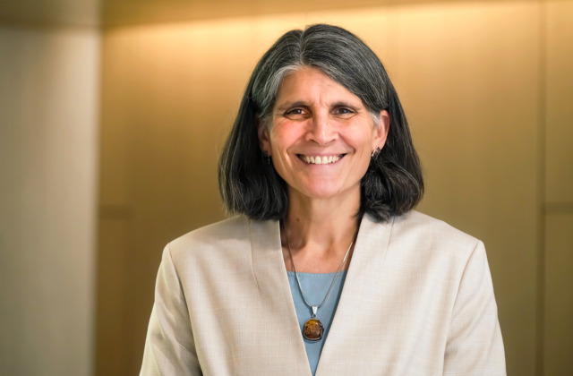 Dean Jill Hamm stands for portrait photo in Peabody Hall lobby.