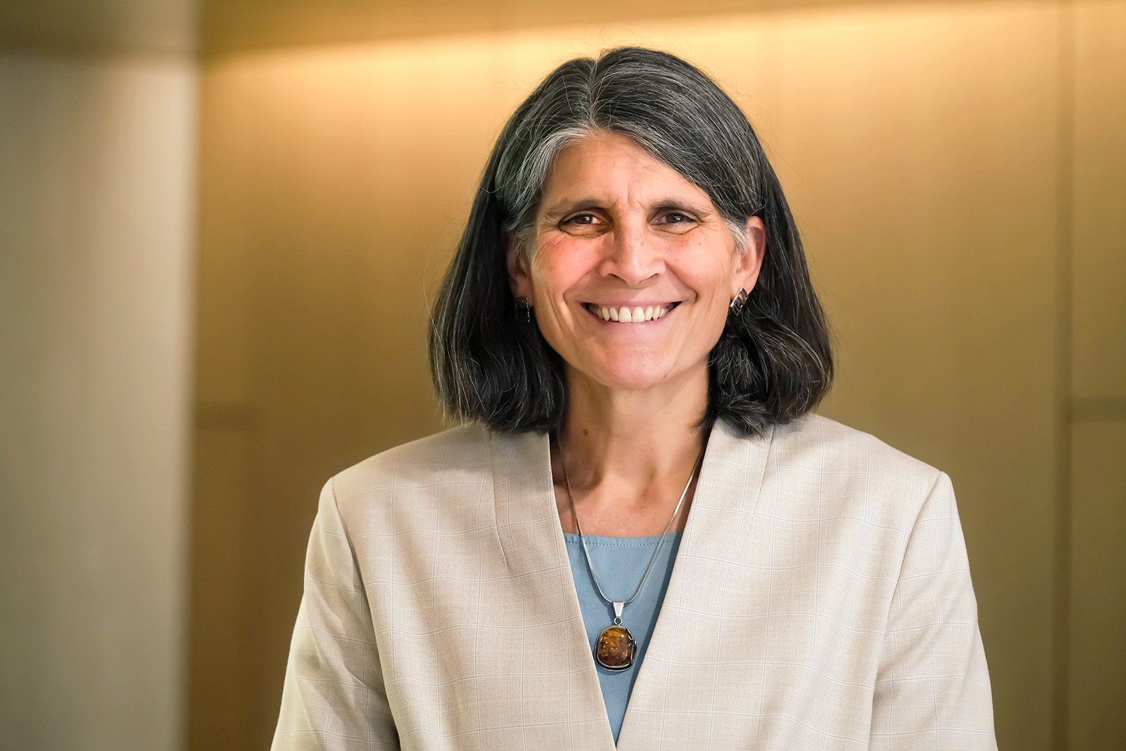Dean Jill Hamm stands for portrait photo in Peabody Hall lobby.