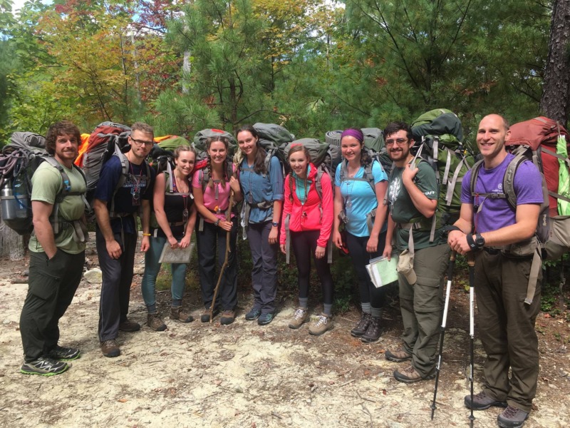 Photo of UNC MAT students hiking during the North Carolina Outward Bound School course.