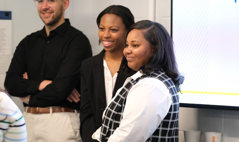 School counseling students present their work to the group.