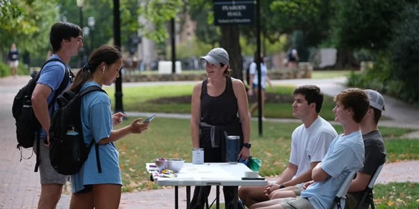 Image of Dorothy Espelage interacting with students.