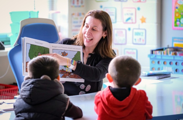 Annemarie Hindman reading to students at Carolina Community Academy.