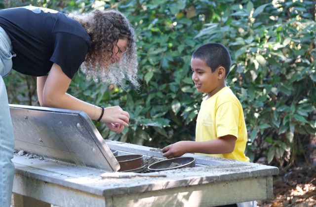 Lexi Bravo with a student during a CCA field trip.