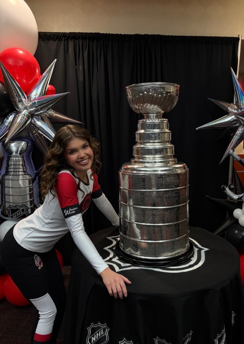 Camryn Tuttle (’26 B.A.Ed.) poses with the Stanley Cup during a Carolina Hurricanes event. (Photo courtesy of Camryn Tuttle)