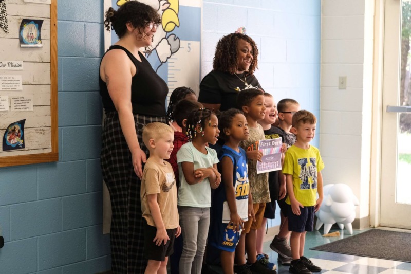 Class of students and teachers pose for photo on first day of school at CCA