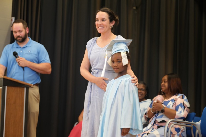 Amy Richardson poses with student during 2026 graduation ceremony