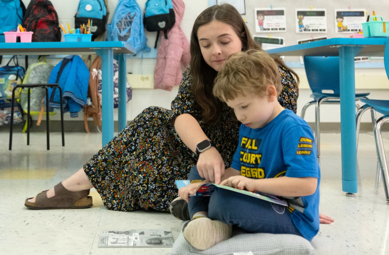 Madison Meyers works with one of her first grade students at Carolina Community Academy in Roxboro, NC.